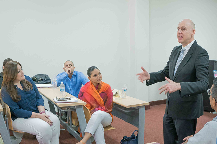 Prof. Guevara Mann in class